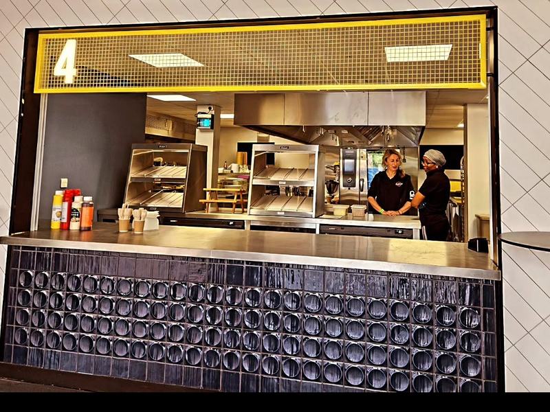 The Currywurst team running a professional venue kitchen